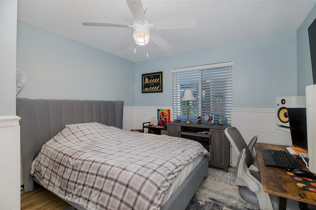 8211 Hayward Lane Port Richey, FL 34668 - Photo 23 of 65 a bedroom with a bed and a window