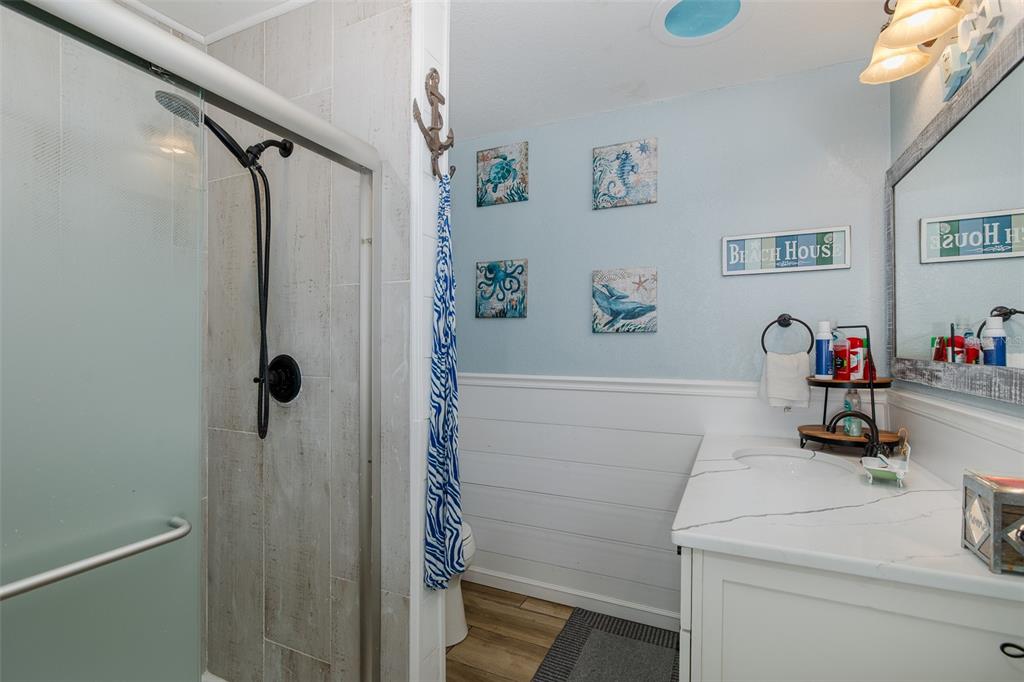 8211 Hayward Lane Port Richey, FL 34668 - Photo 25 of 65 a bathroom with a shower and a sink