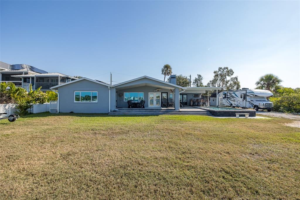 8211 Hayward Lane Port Richey, FL 34668 - Photo 37 of 65 a front view of house with outdoor space and swimming pool