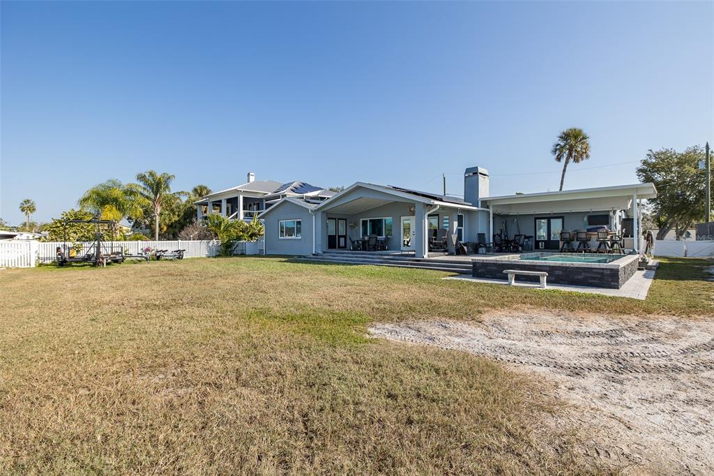 8211 Hayward Lane Port Richey, FL 34668 - Photo 38 of 65 a view of house with outdoor space and sitting area