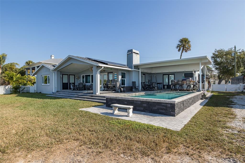 8211 Hayward Lane Port Richey, FL 34668 - Photo 39 of 65 a view of a house with swimming pool and a yard