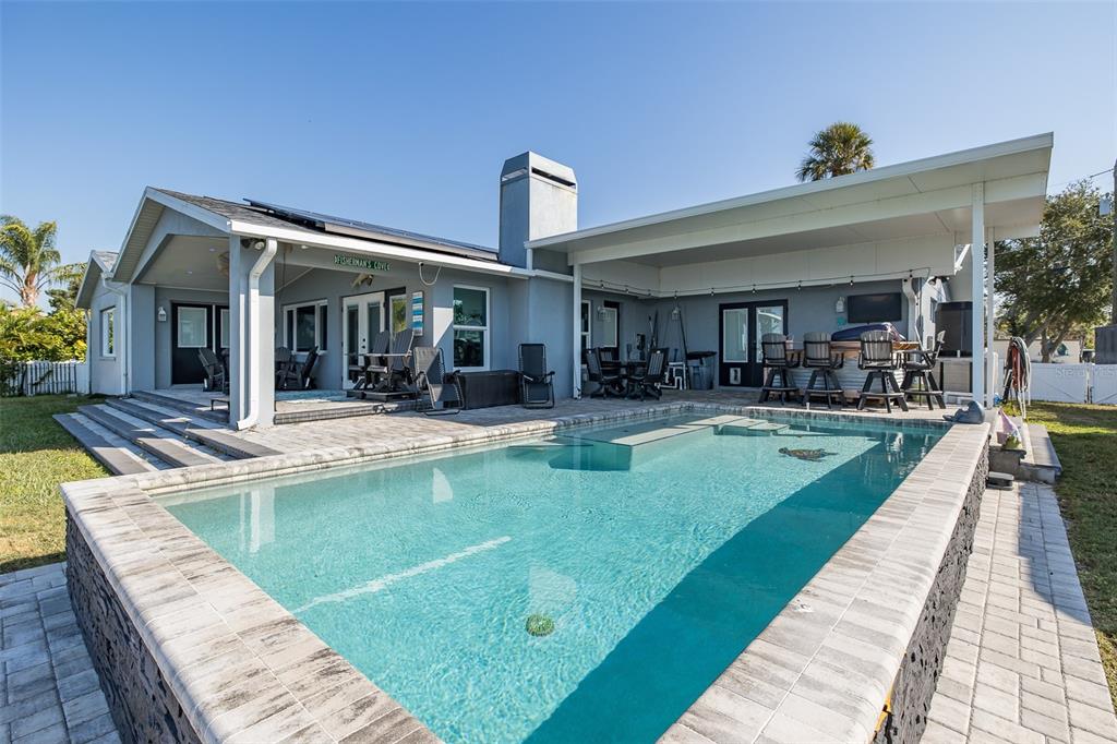 8211 Hayward Lane Port Richey, FL 34668 - Photo 41 of 65 a view of a house with swimming pool and sitting area