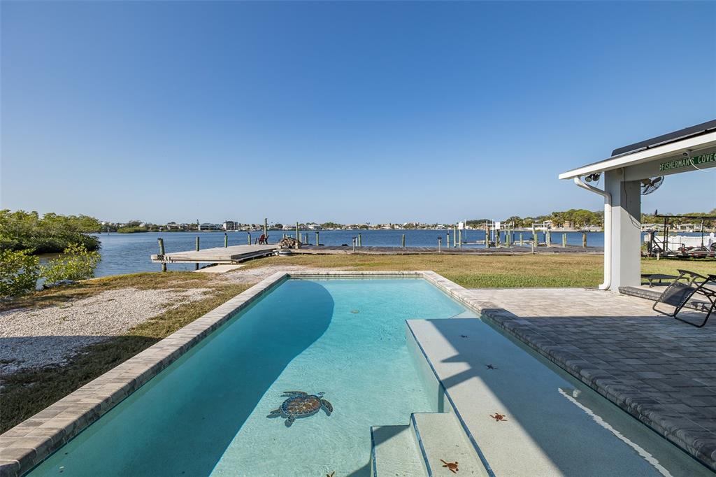 8211 Hayward Lane Port Richey, FL 34668 - Photo 42 of 65 a view of swimming pool with outdoor space and seating area