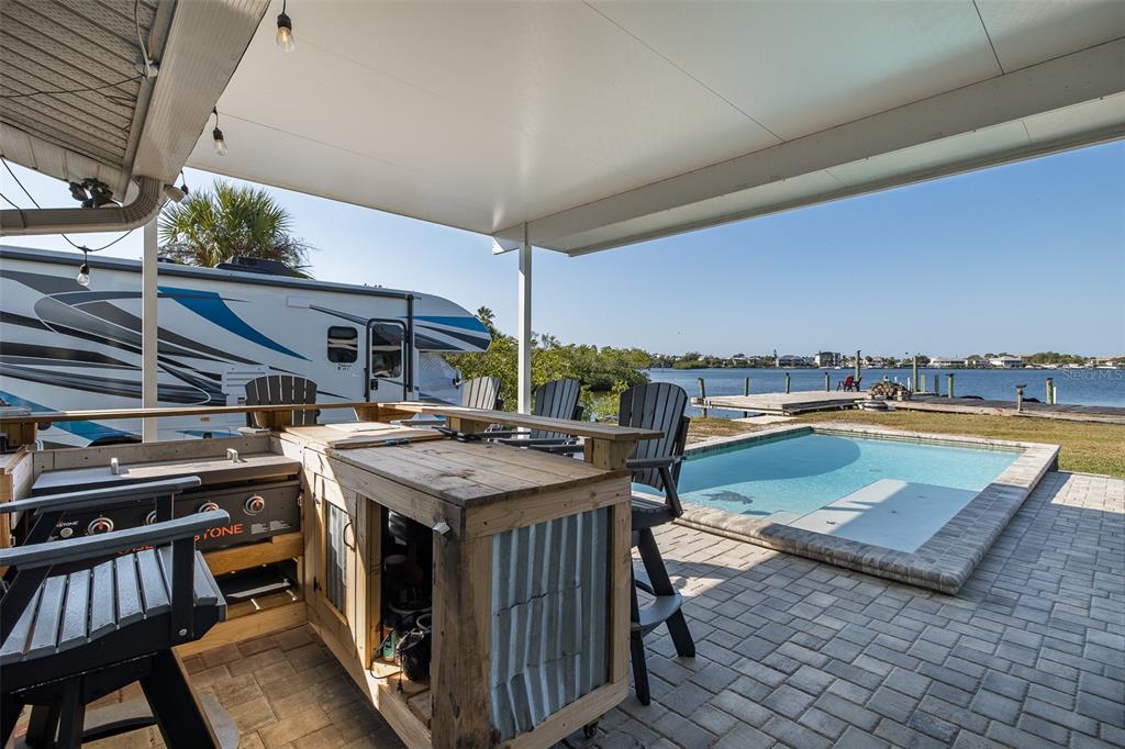 8211 Hayward Lane Port Richey, FL 34668 - Photo 44 of 65 a view of a swimming pool with a patio