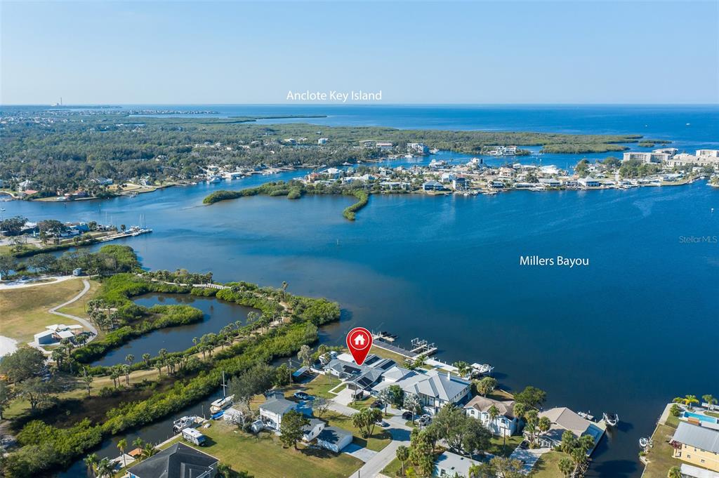 8211 Hayward Lane Port Richey, FL 34668 - Photo 55 of 65 an aerial view of a house with a lake view