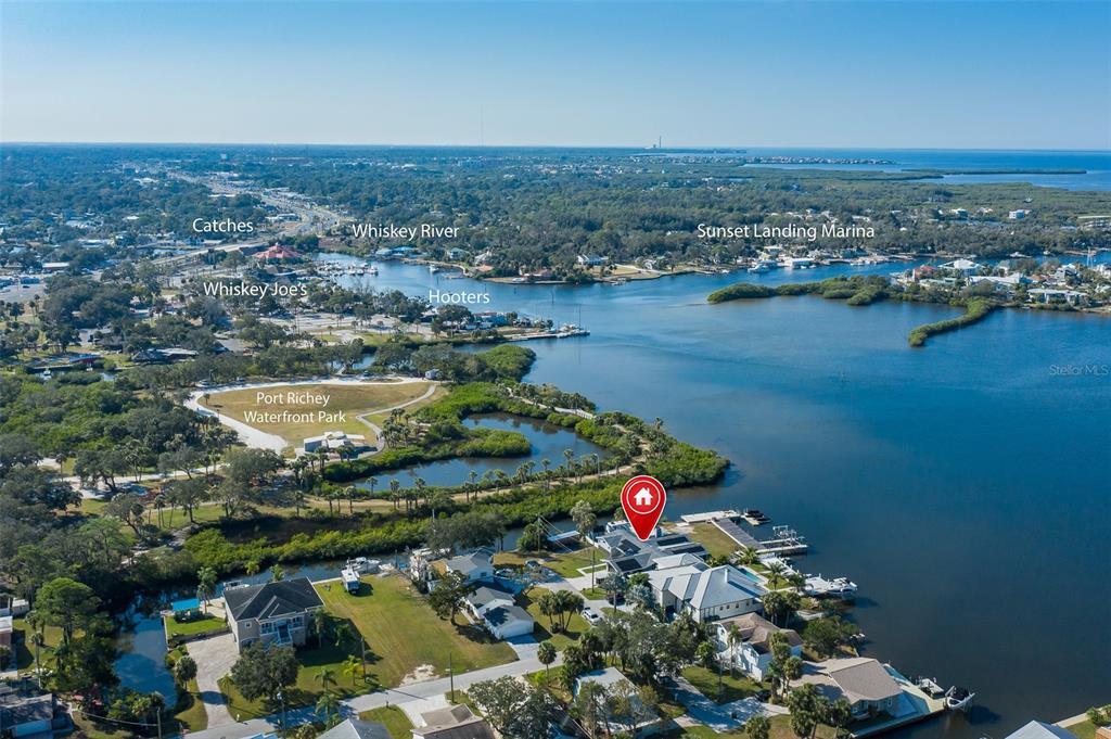 8211 Hayward Lane Port Richey, FL 34668 - Photo 56 of 65 an aerial view of a houses with a lake view
