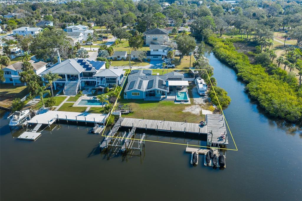 8211 Hayward Lane Port Richey, FL 34668 - Photo 59 of 65 an aerial view of a house with swimming pool patio and outdoor seating