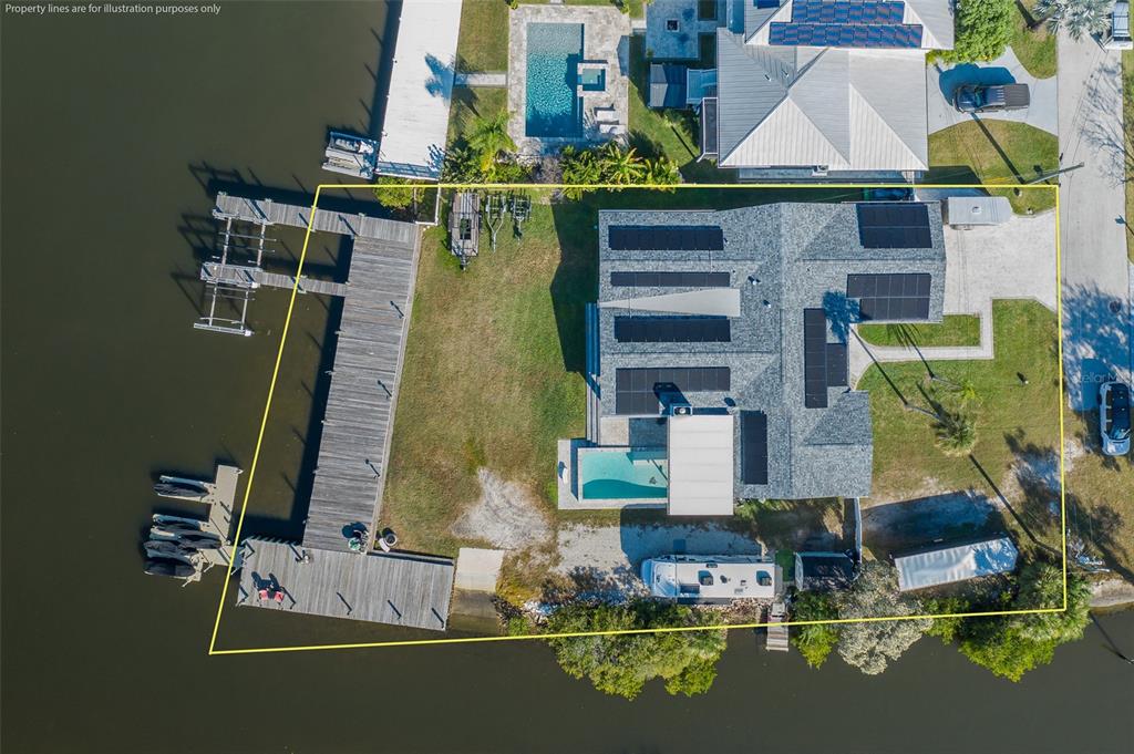 8211 Hayward Lane Port Richey, FL 34668 - Photo 60 of 65 an aerial view of a house with swimming pool outdoor seating and yard