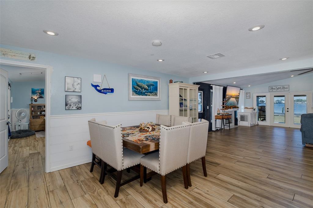 8211 Hayward Lane Port Richey, FL 34668 - Photo 10 of 65 a view of a dining room with furniture and wooden floor