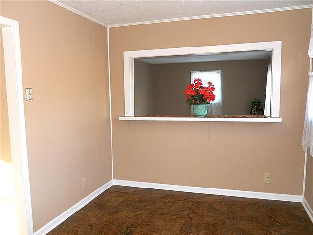 836 Cowan Road Dickson, TN 37055 - Photo 9 of 20 Close-up of the dining area showing the pass-through to the living room.