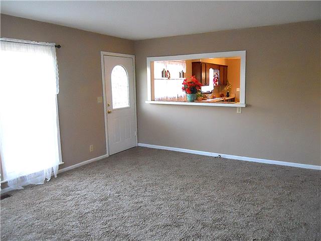 836 Cowan Road Dickson, TN 37055 - Photo 10 of 20 The spacious living room has new carpet and is family sized.