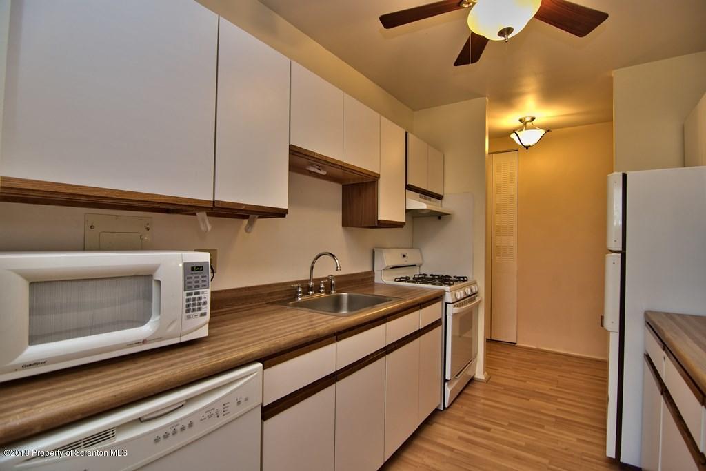 1610 Summit Pointe Scranton, PA 18508 - Photo 3 of 17 a kitchen with a sink and cabinets
