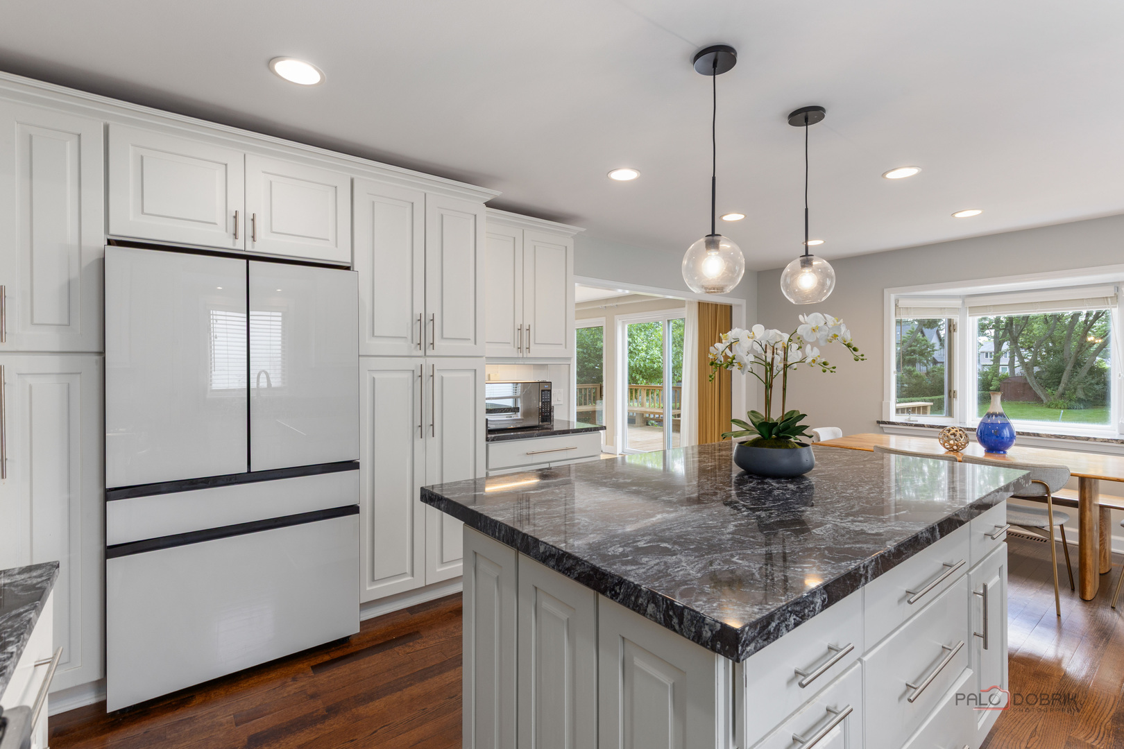 2965 Keystone Road Northbrook, IL 60062 - Photo 13 of 40 a kitchen with stainless steel appliances granite countertop a sink a refrigerator and a white cabinets
