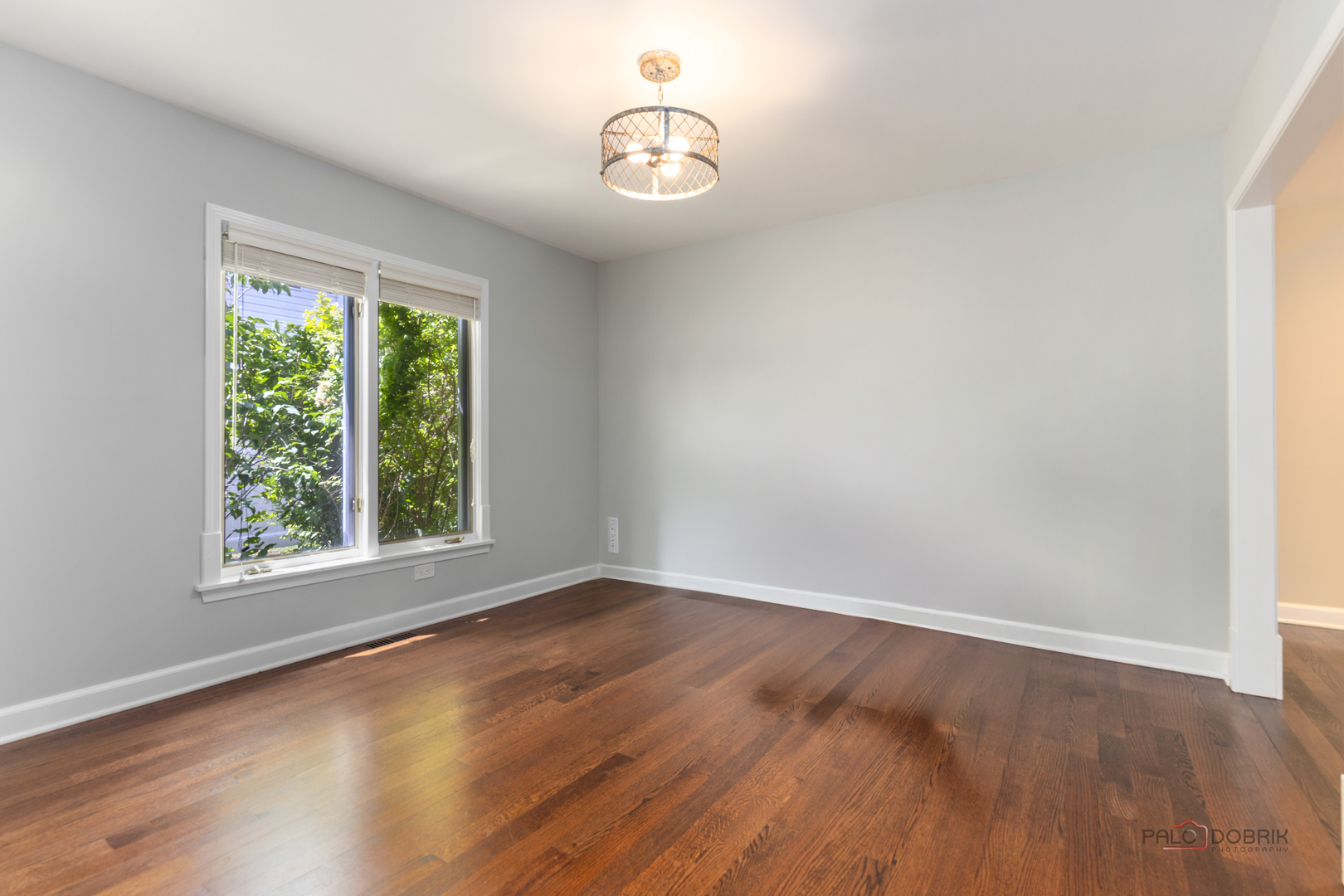 2965 Keystone Road Northbrook, IL 60062 - Photo 7 of 40 an empty room with wooden floor and windows
