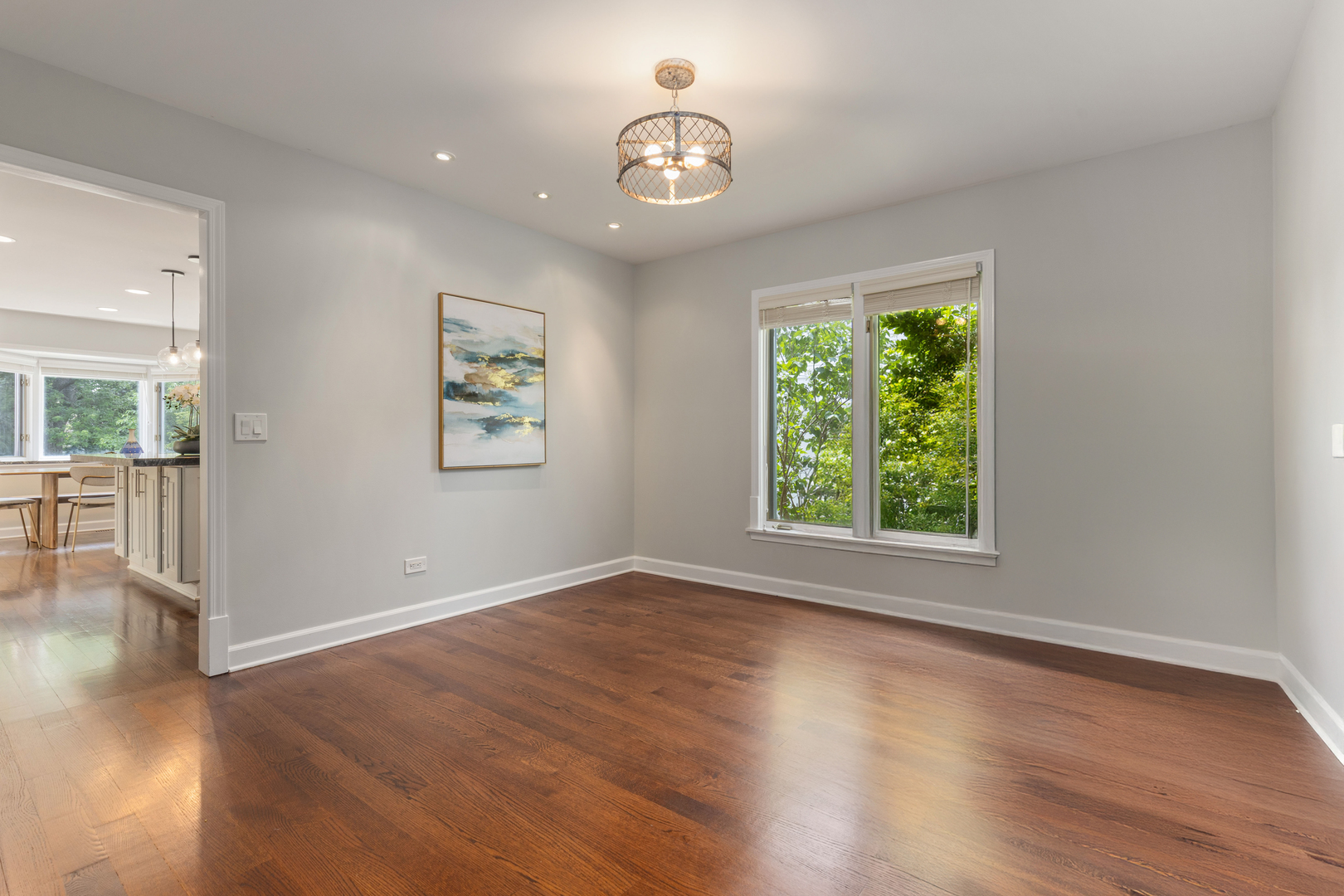 2965 Keystone Road Northbrook, IL 60062 - Photo 8 of 40 a view of an empty room with wooden floor and a window