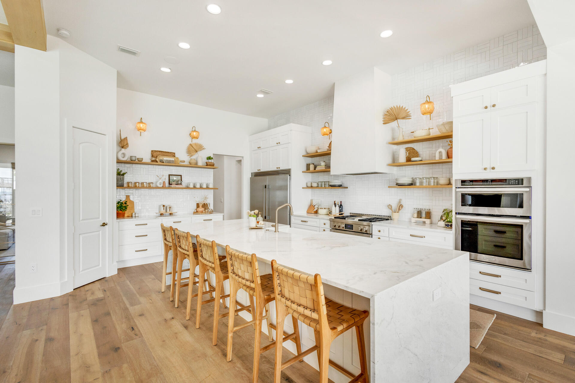 1341 Driftwood Point Road Santa Rosa Beach, FL 32459 - Photo 11 of 55 a kitchen with stainless steel appliances a stove a sink and a refrigerator