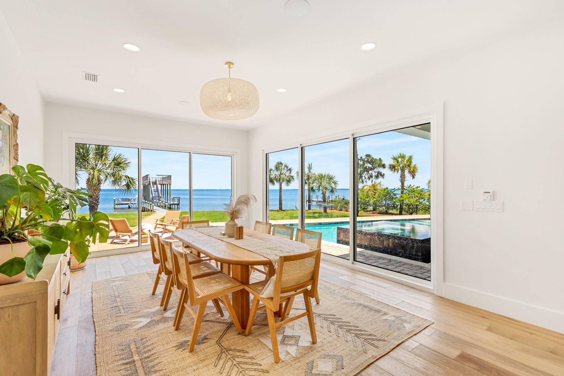 1341 Driftwood Point Road Santa Rosa Beach, FL 32459 - Photo 14 of 55 a view of a dining room with furniture window and wooden floor
