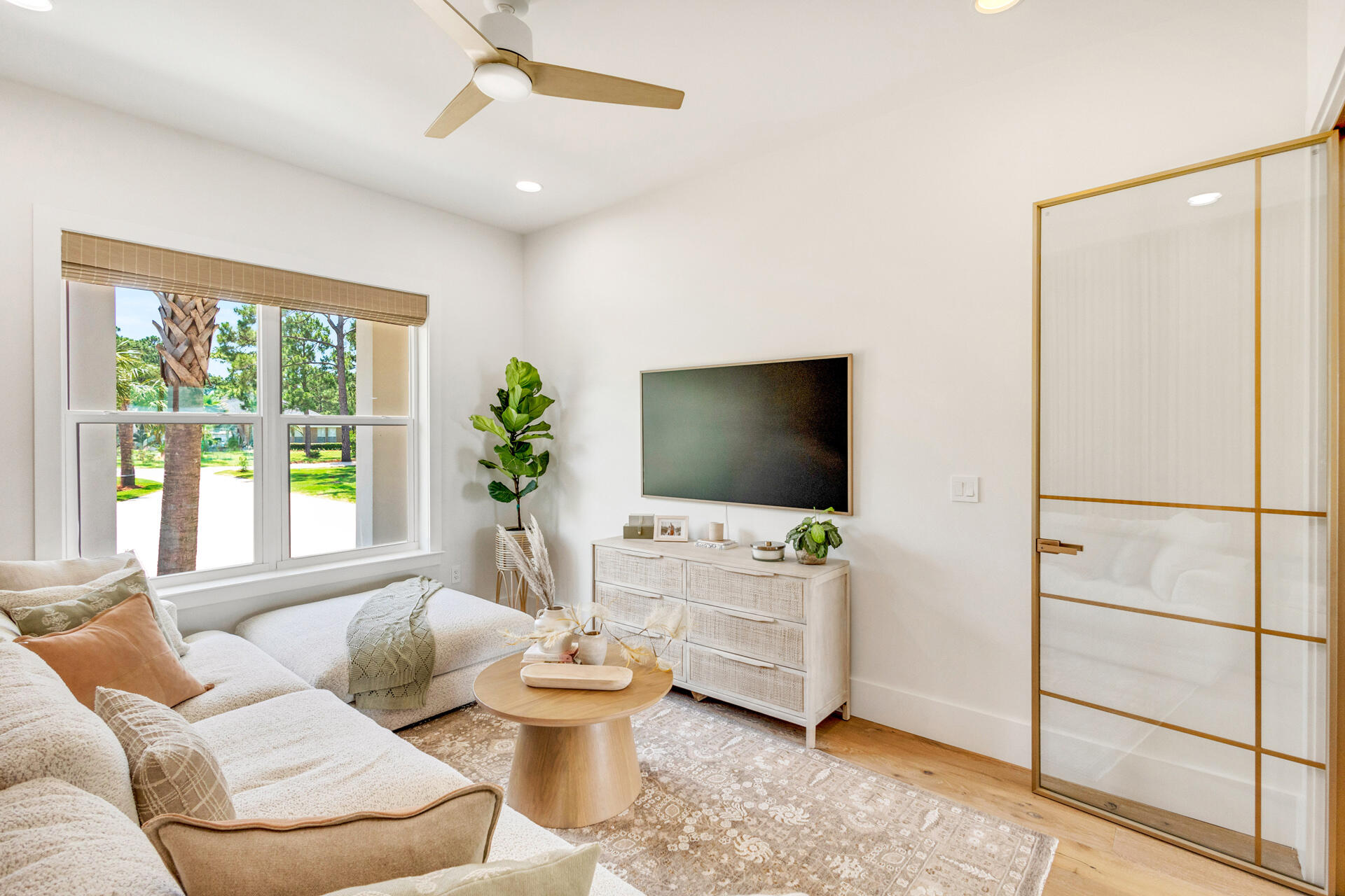 1341 Driftwood Point Road Santa Rosa Beach, FL 32459 - Photo 34 of 55 a living room with furniture and a flat screen tv