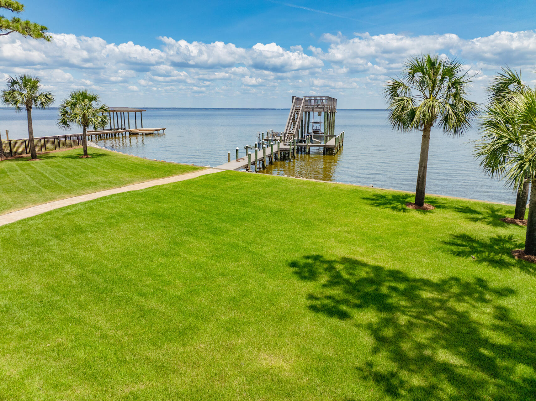 1341 Driftwood Point Road Santa Rosa Beach, FL 32459 - Photo 47 of 55 a view of a swimming pool with a yard and a garden