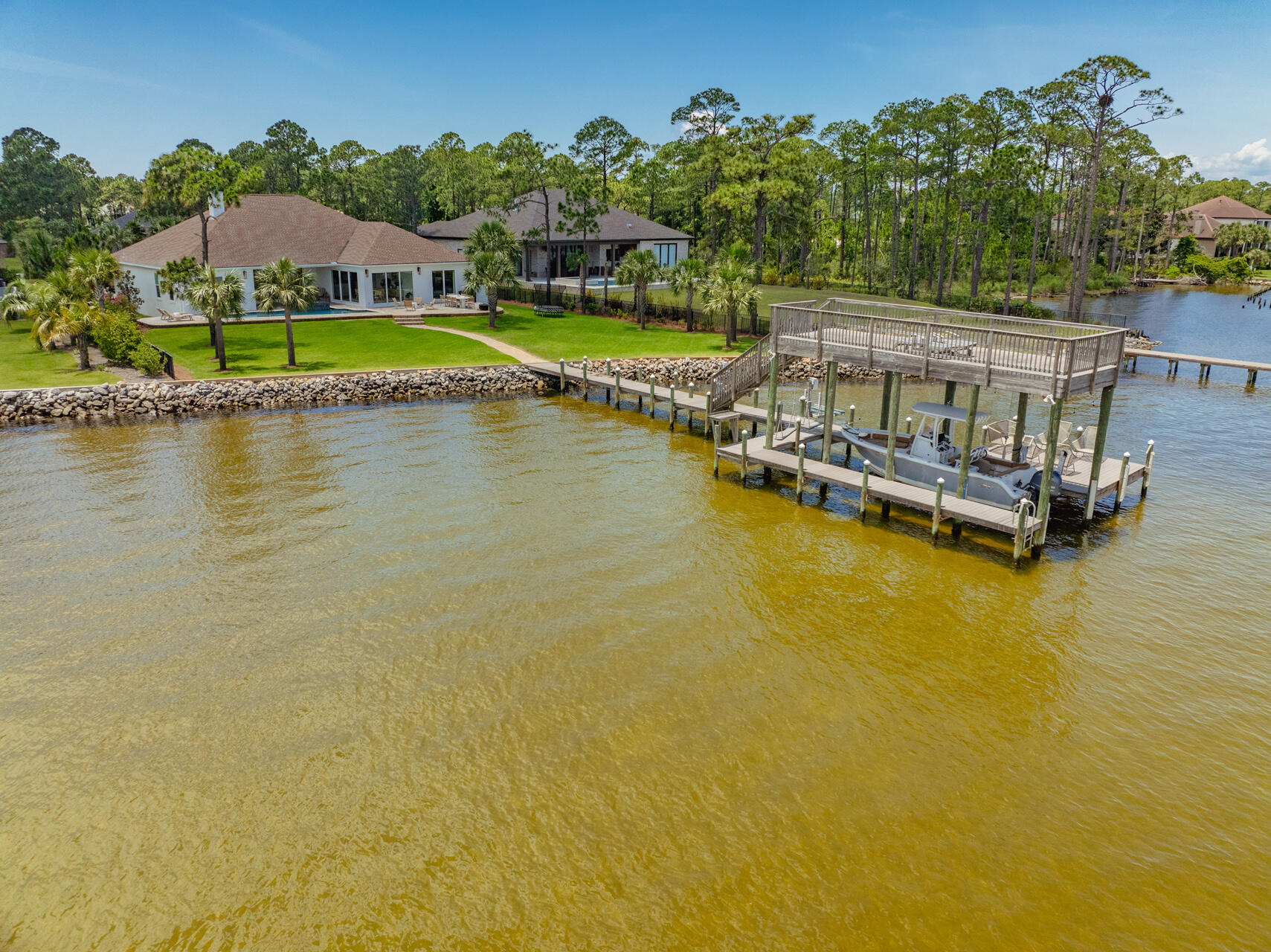 1341 Driftwood Point Road Santa Rosa Beach, FL 32459 - Photo 50 of 55 a view of a house next to a lake with houses