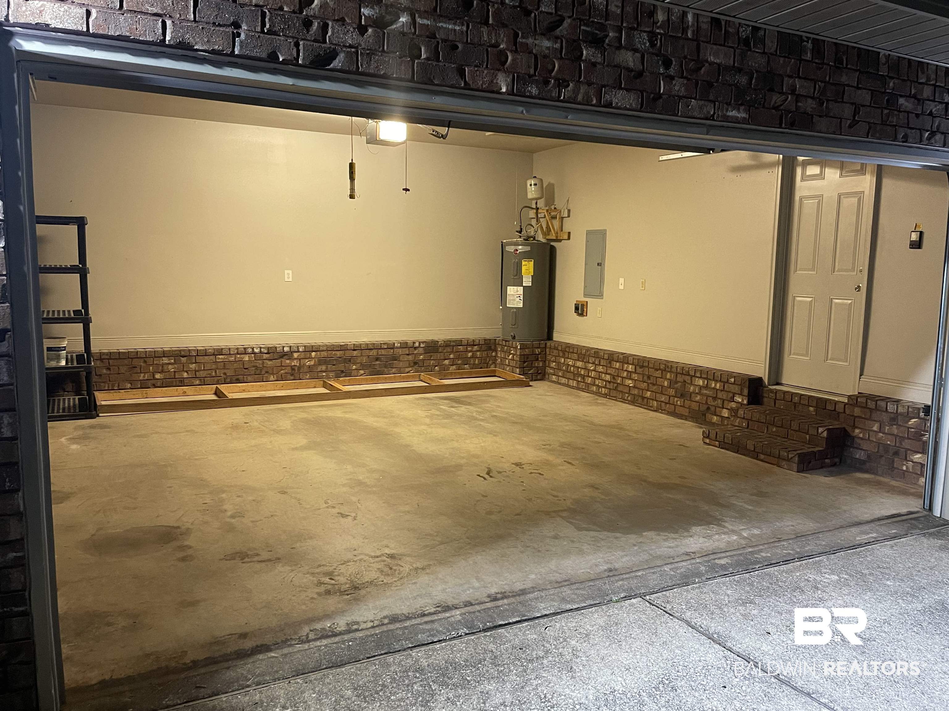 10753 Rigby Drive Mobile, AL 36695 - Photo 33 of 33 Garage with shelving and 30-amp RV plug accesses spacious Mud Room.