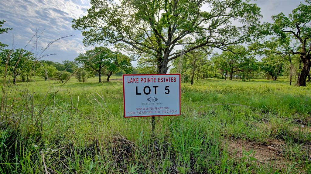Tbd Tradewinds Road Nocona, TX 76255 - Photo 19 of 32 a sign board with green space