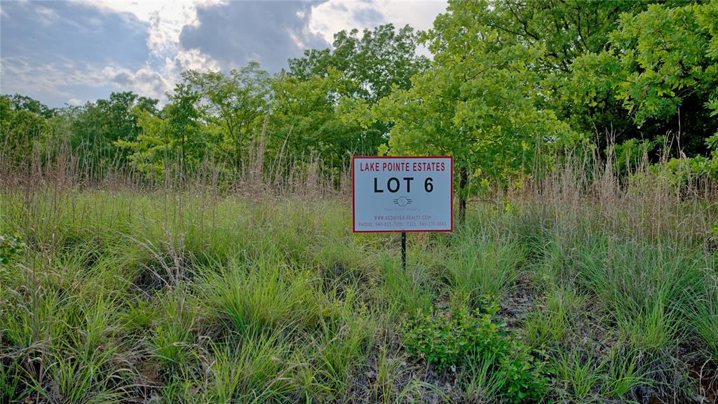 Tbd Tradewinds Road Nocona, TX 76255 - Photo 8 of 32 a sign broad in front of a lake
