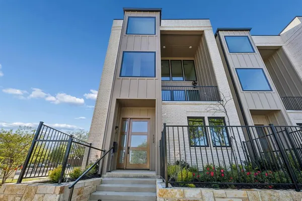 a view of a garden from a balcony