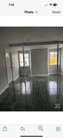 a view of an empty room and window