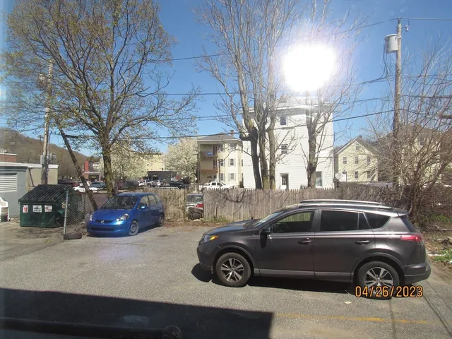 a view of a car parked in front of a house