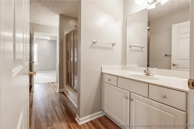 a bathroom with a double vanity sink and mirror