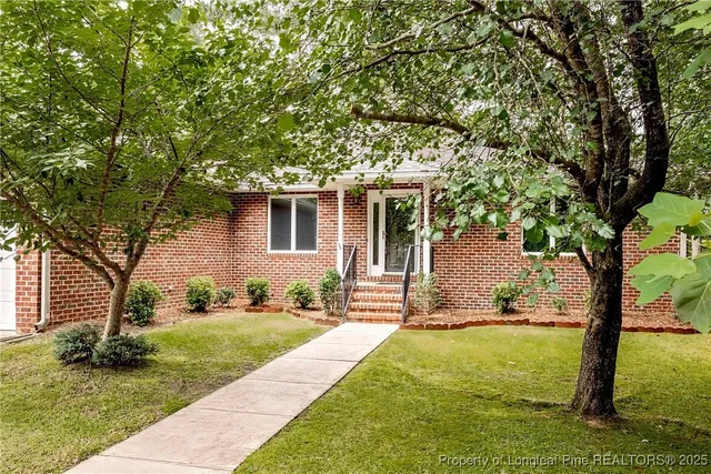 a view of a house with a yard