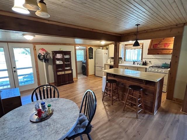 239 Ranch Road Joshua, TX 76058 - Photo 11 of 34 a dining room with furniture a window and wooden floor