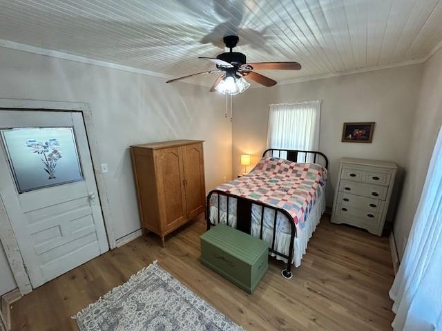 239 Ranch Road Joshua, TX 76058 - Photo 18 of 34 a bedroom with a bed and wooden floor