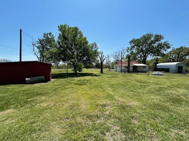 239 Ranch Road Joshua, TX 76058 - Photo 28 of 34 a view of a backyard with a garden and entertaining space