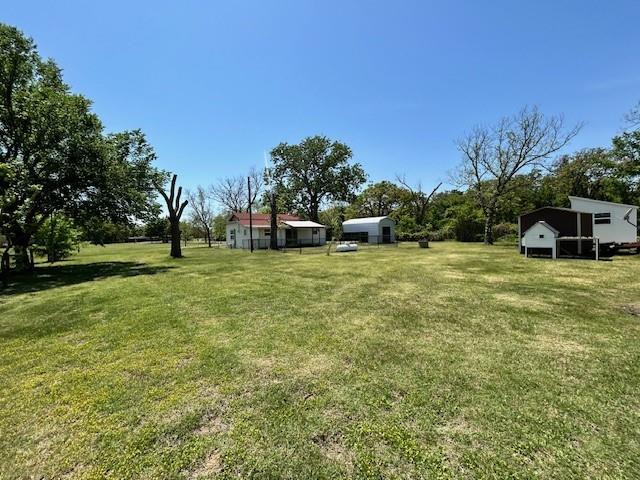 239 Ranch Road Joshua, TX 76058 - Photo 29 of 34 a view of a house with a yard
