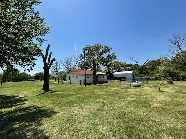 239 Ranch Road Joshua, TX 76058 - Photo 31 of 34 a swimming pool with wooden fence