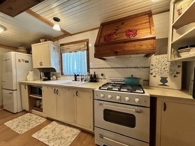 239 Ranch Road Joshua, TX 76058 - Photo 6 of 34 a kitchen with a stove and a refrigerator