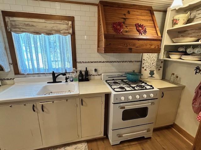 239 Ranch Road Joshua, TX 76058 - Photo 8 of 34 a kitchen with a stove and a sink