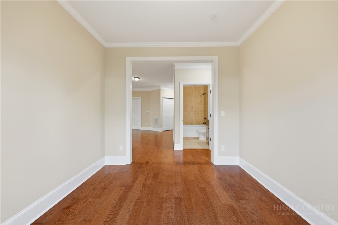 155 Gateway Drive, Unit 101 Boone, NC 28607 - Photo 17 of 50 a view of a room with wooden floor and bathroom