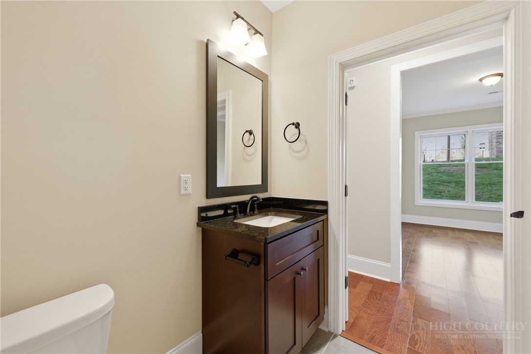 155 Gateway Drive, Unit 101 Boone, NC 28607 - Photo 19 of 50 a kitchen with stainless steel appliances granite countertop a stove and a sink