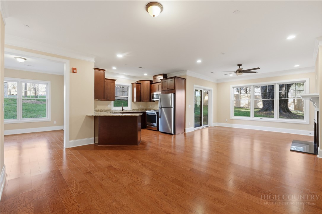 155 Gateway Drive, Unit 101 Boone, NC 28607 - Photo 2 of 50 a large kitchen with stainless steel appliances granite countertop a refrigerator and a sink