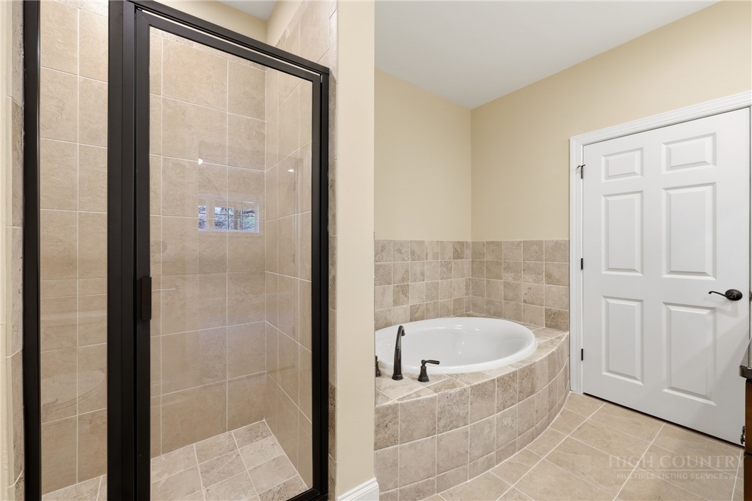 155 Gateway Drive, Unit 101 Boone, NC 28607 - Photo 26 of 50 a bathroom with shower and bathtub