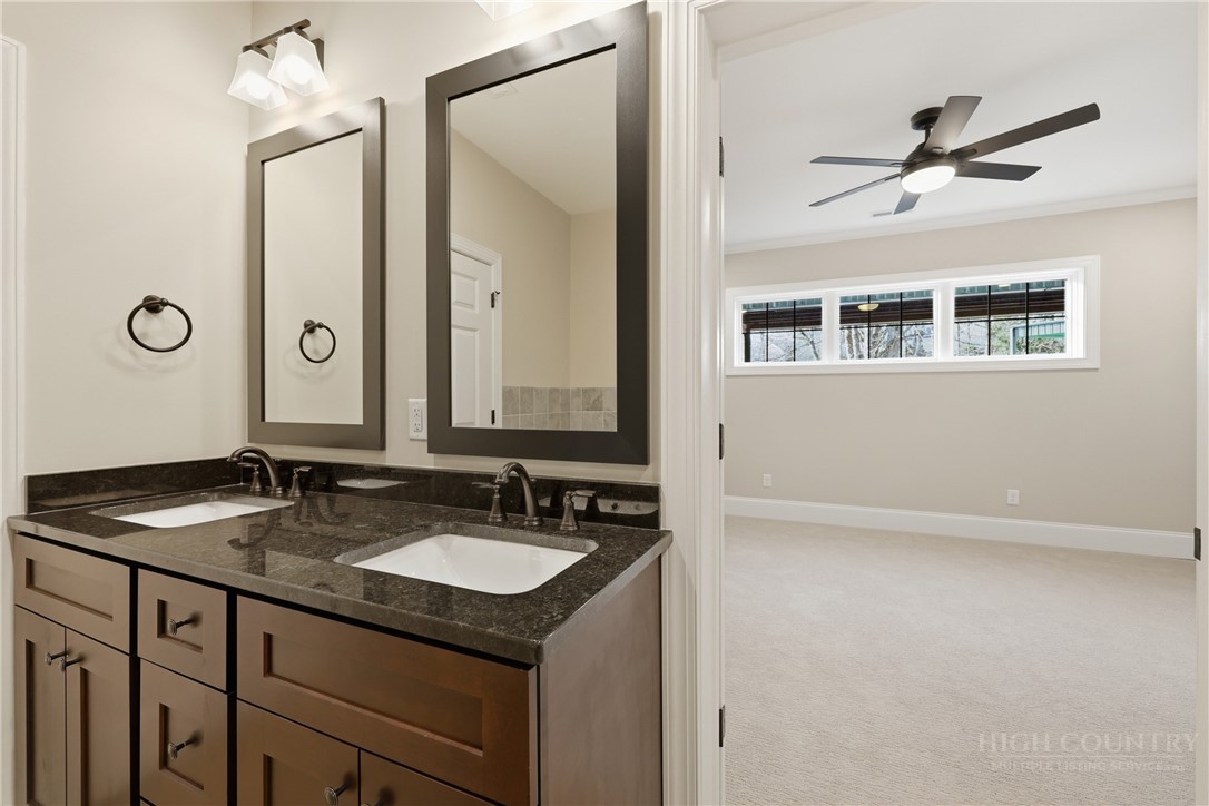 155 Gateway Drive, Unit 101 Boone, NC 28607 - Photo 27 of 50 a bathroom with a sink and a mirror