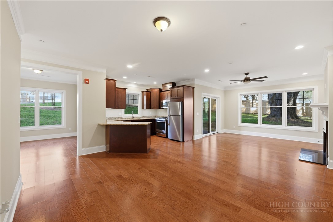 155 Gateway Drive, Unit 101 Boone, NC 28607 - Photo 6 of 50 a large kitchen with a large window and stainless steel appliances