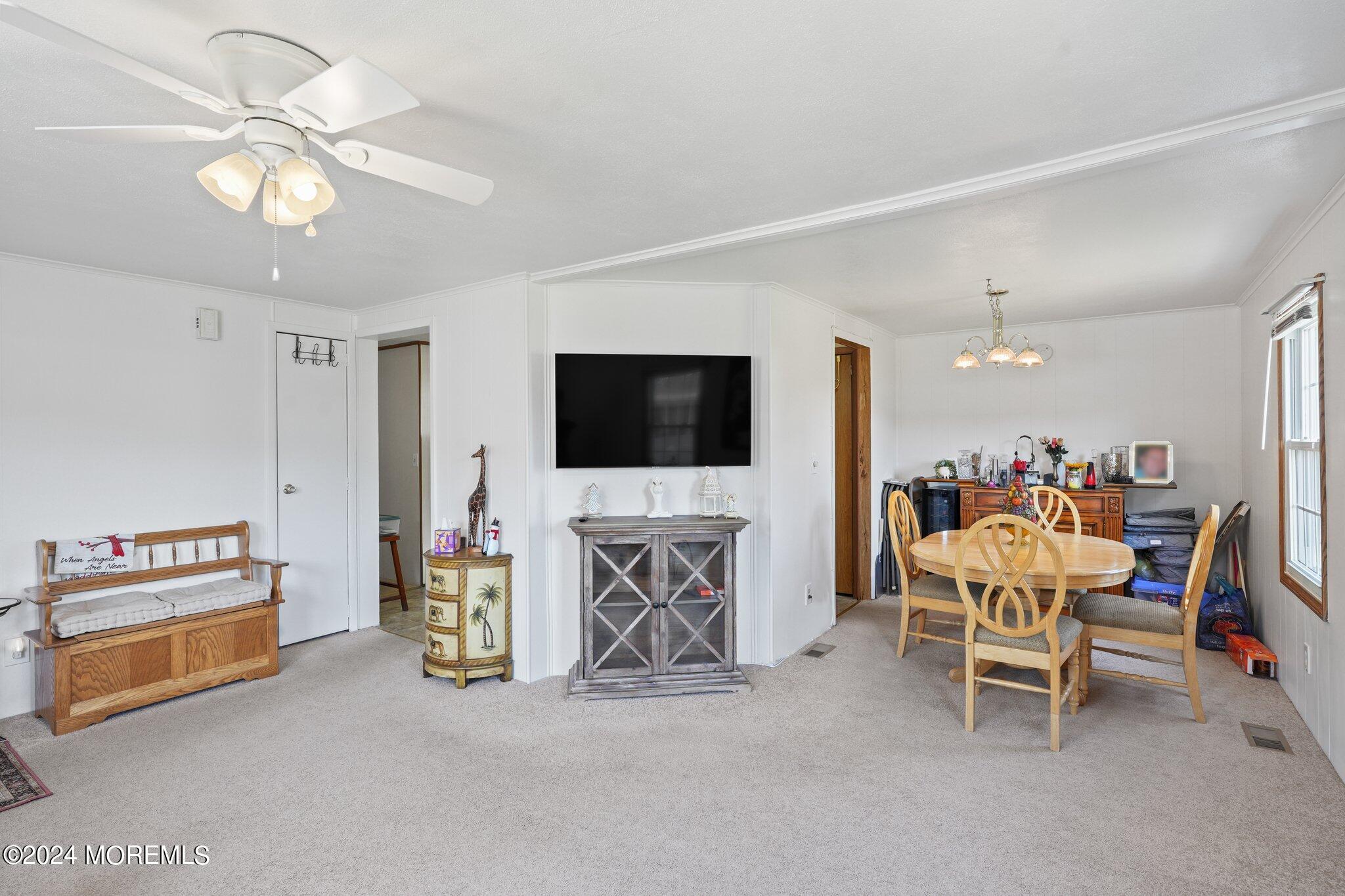 497 Rosalind Road Freehold, NJ 07728 - Photo 1 of 23 a living room with furniture and a flat screen tv