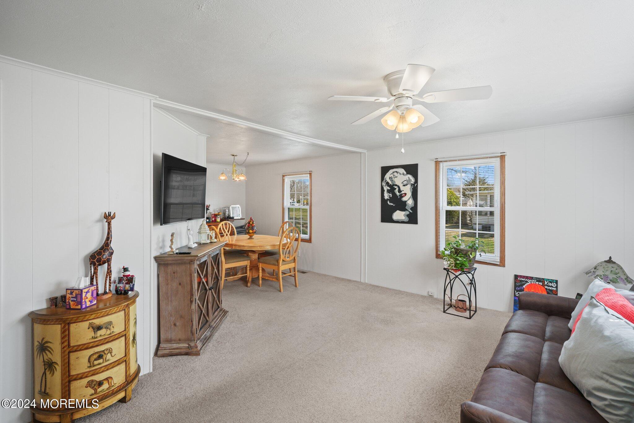 497 Rosalind Road Freehold, NJ 07728 - Photo 14 of 23 a living room with furniture and a flat screen tv