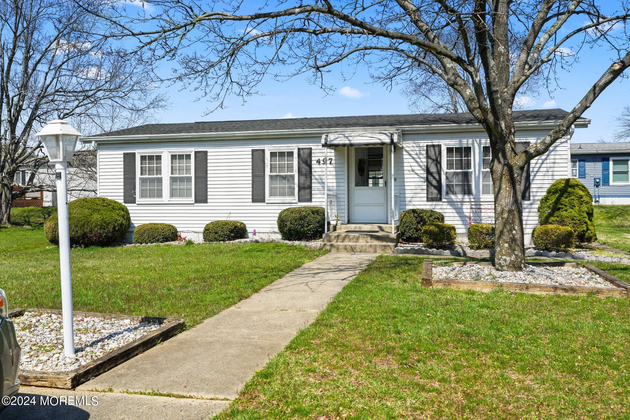 497 Rosalind Road Freehold, NJ 07728 - Photo 5 of 23 a view of a house with backyard sitting area and garden