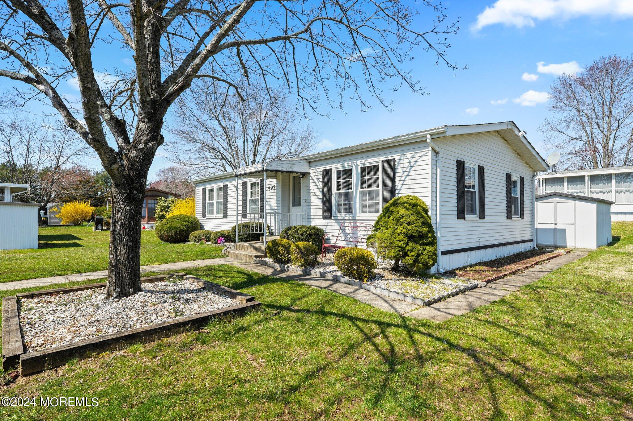 497 Rosalind Road Freehold, NJ 07728 - Photo 6 of 23 a front view of a house with garden