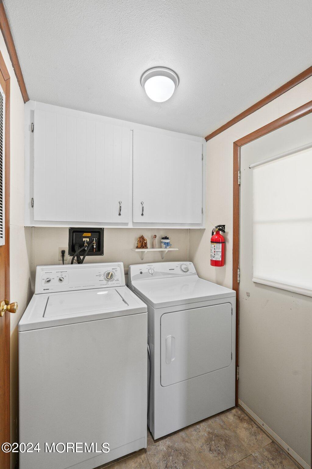 497 Rosalind Road Freehold, NJ 07728 - Photo 9 of 23 a utility room with dryer and washer